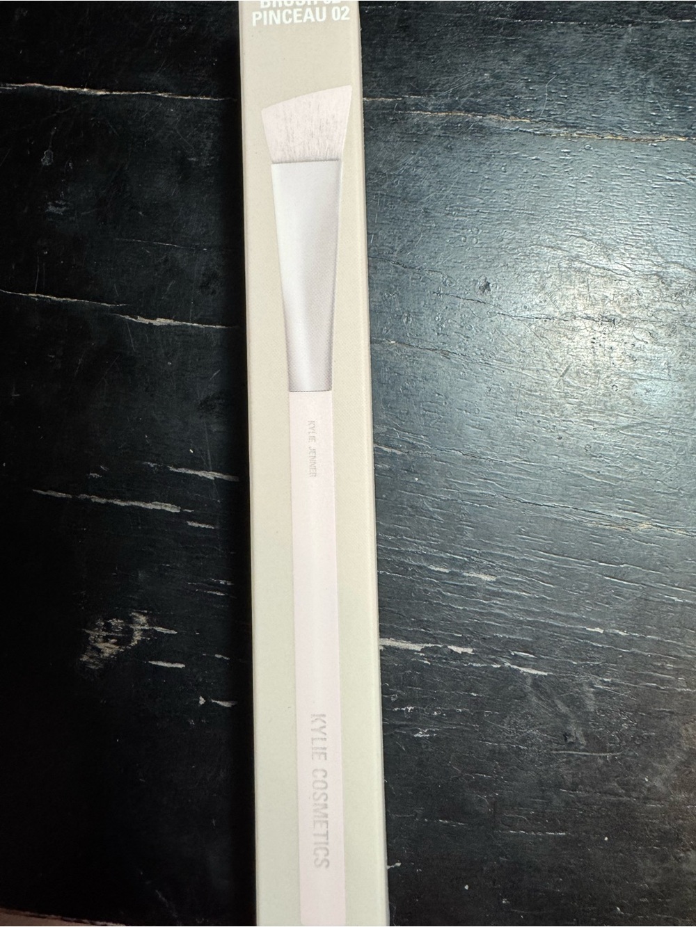 Kylie Cosmetics angled makeup brush in white